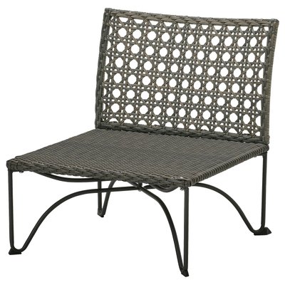 IKEA JUTHOLMEN One-seat section, outdoor Black wicker chair with curved legs and intricate back design.